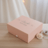 Elegantly displayed pink custom gift box for a bride, featuring "Bride" and the wedding date "18.07.2026" on the lid, perfect for bridal shower gifts or wedding morning preparations.