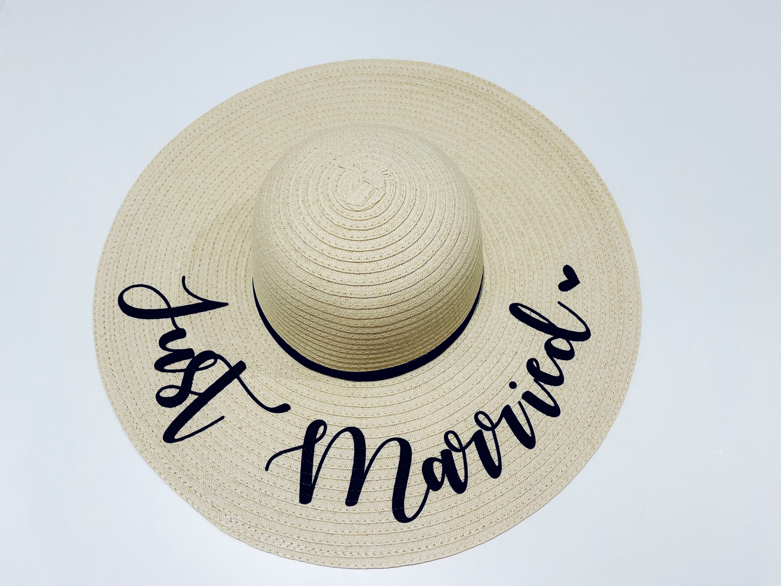 Natural wide brimmed sun hat with black “Just Married” script – perfect honeymoon and bride to be accessory.