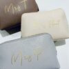 Personalised leather look make up bags in neutral colours with gold script names